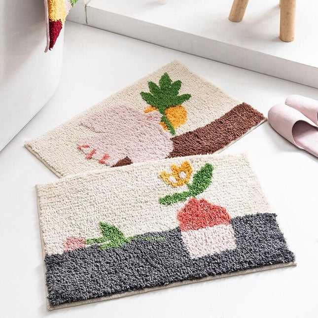 Design-kylpymatto kukkakuvioinnilla