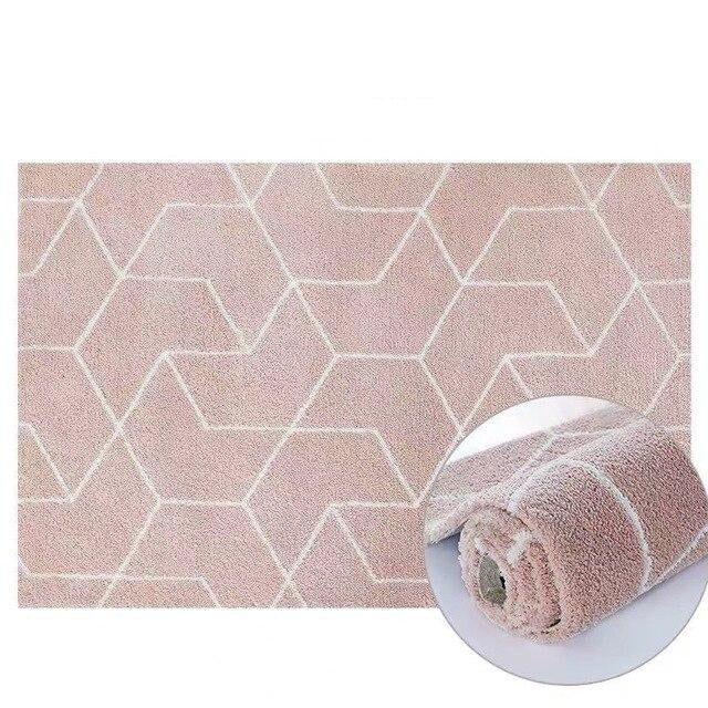 Puuterinpunainen pörrömatto geometrisella kuviolla