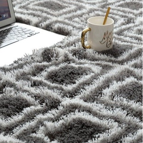 Tummanharmaa-valkoinen berber-pörrömatto