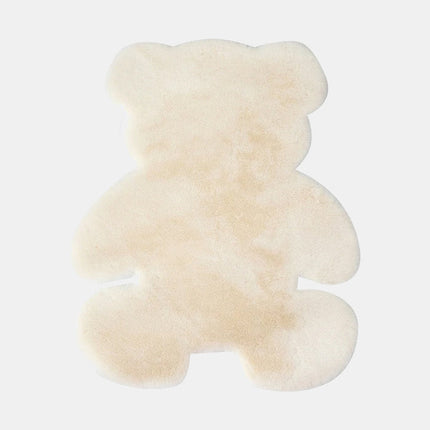 Valkoinen nallekarhun muotoinen turkismatto