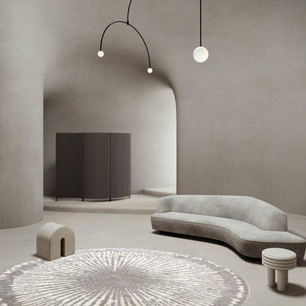 Pyöreä harmaa berberimatto modernilla kuviolla