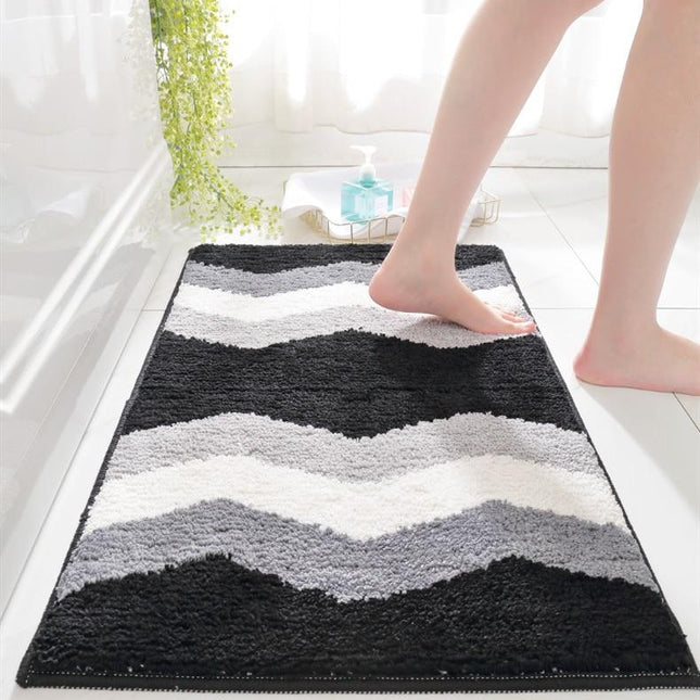 Mustavalkoinen kylpymatto aaltokuviolla